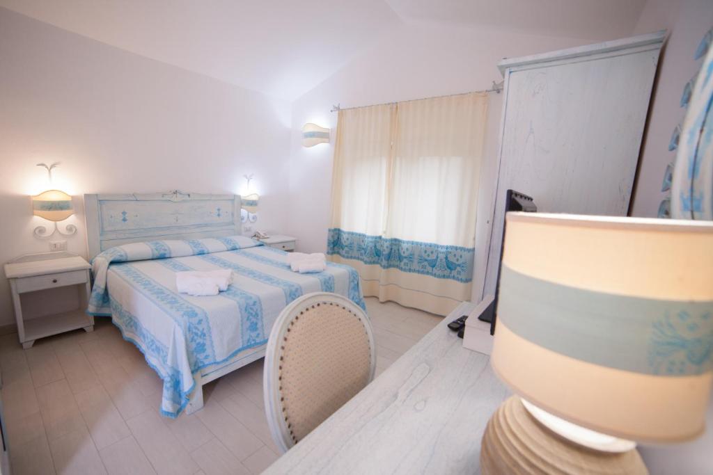 Postel nebo postele na pokoji v ubytování Hotel Golden Gate