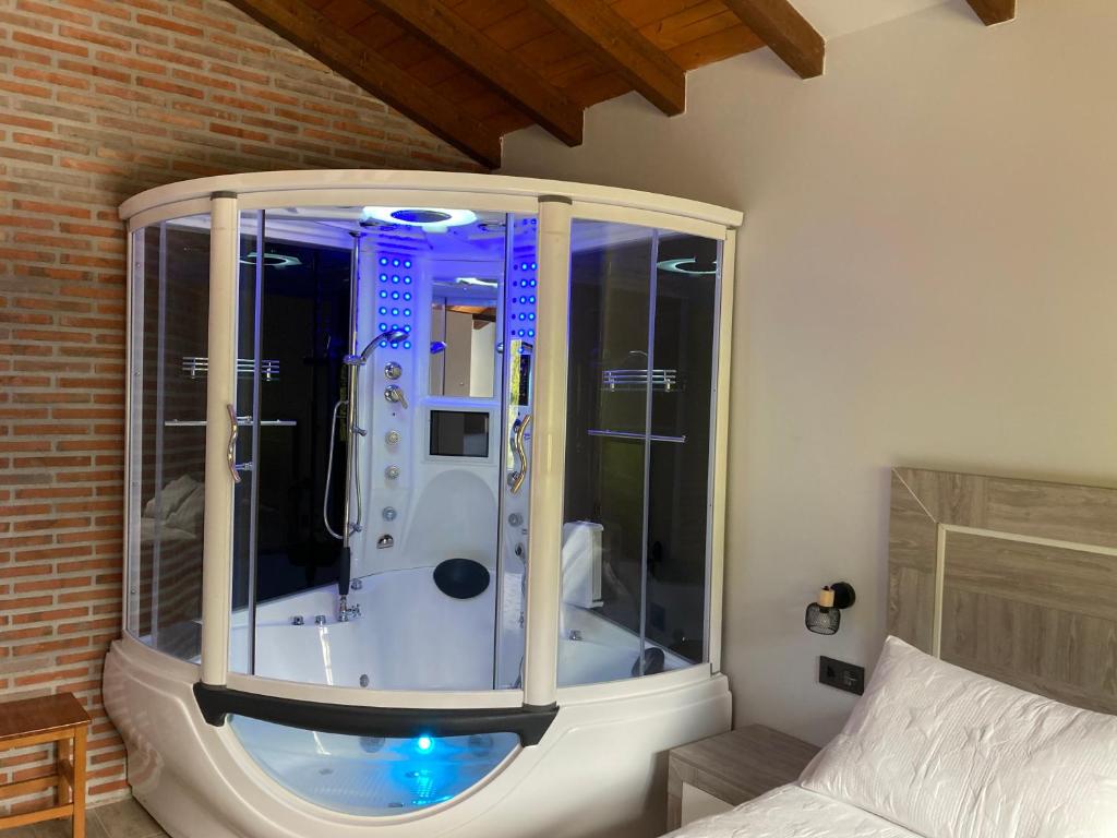 a bathroom with a shower in a room at FUENTE OSCURA in Ramales de la Victoria