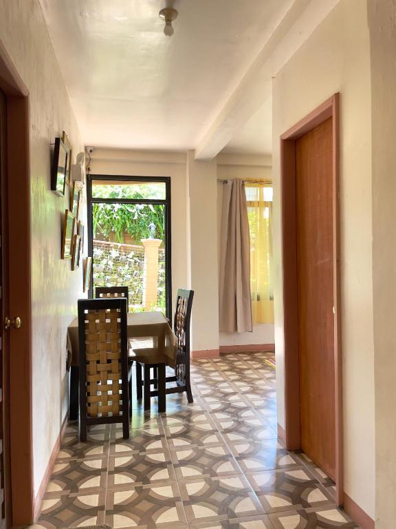 a dining room with a table and chairs at Andrew & Mary's Lodging House in Sagada