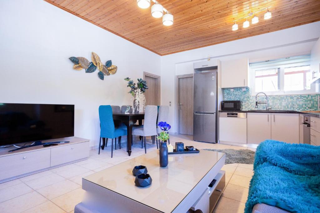 a living room with a couch and a table at Zante Sunny Mountain in Anafonítria