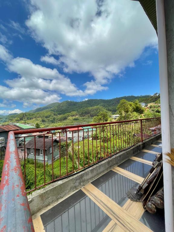 a balcony with a view of the mountains at Andrew & Mary's Lodging House in Sagada