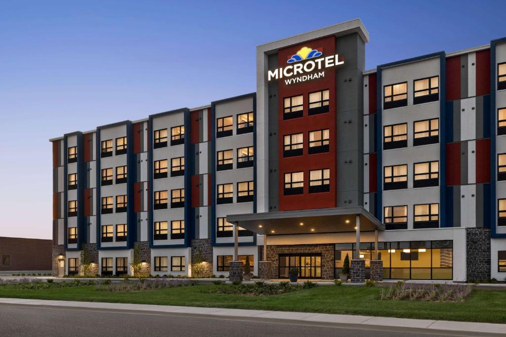 a rendering of the exterior of a microsoft headquarters at Microtel Inn & Suites by Wyndham Boisbriand in Sainte-Thérèse-de-Blainville