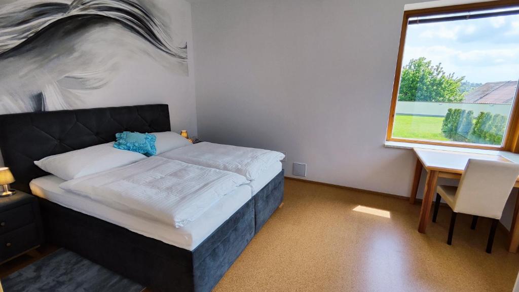 Postel nebo postele na pokoji v ubytování Apartmány Dačice