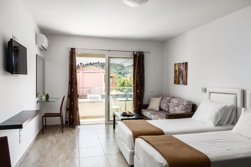 TV a/nebo společenská místnost v ubytování Delight Corfu Apart Hotel, Sidari