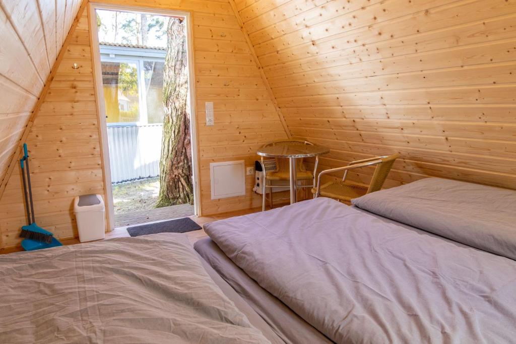 Postel nebo postele na pokoji v ubytování Ostseecamping Peenemündung