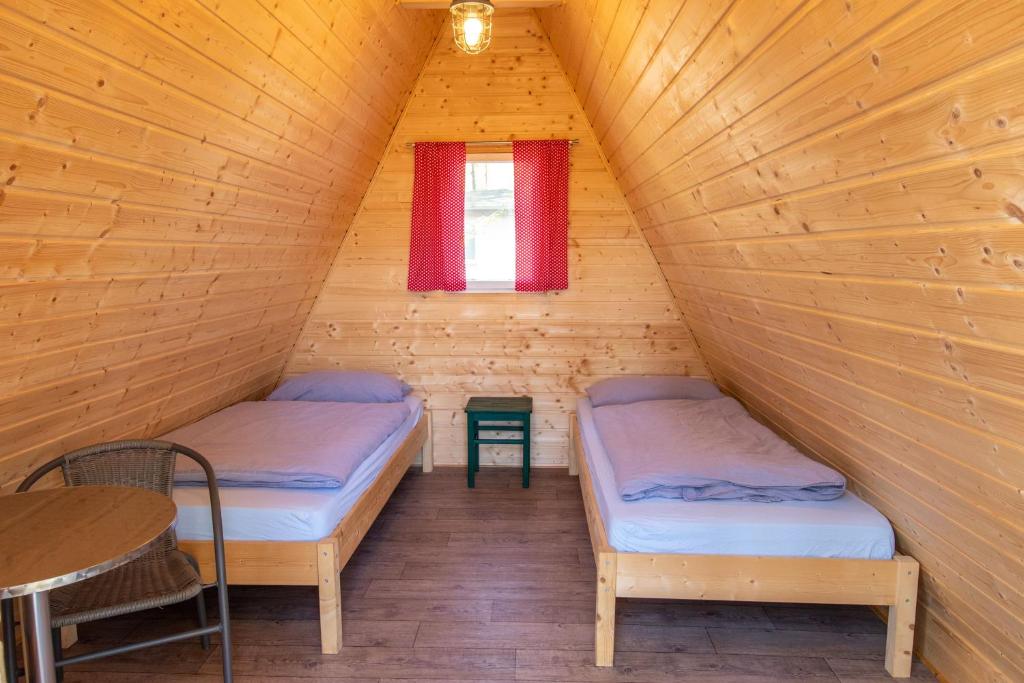 Postel nebo postele na pokoji v ubytování Ostseecamping Peenemündung