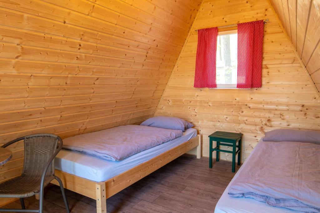Postel nebo postele na pokoji v ubytování Ostseecamping Peenemündung