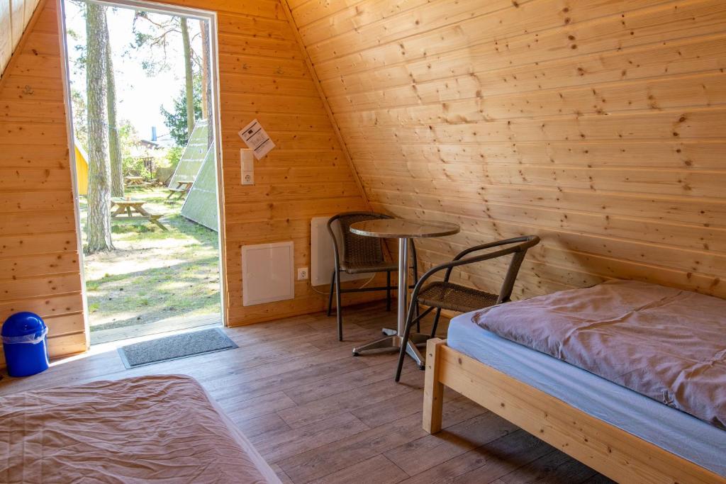 Postel nebo postele na pokoji v ubytování Ostseecamping Peenemündung