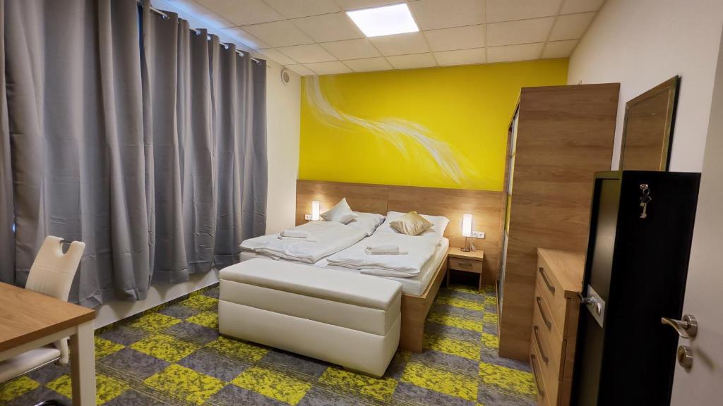 Postel nebo postele na pokoji v ubytování Apartmány Dačice