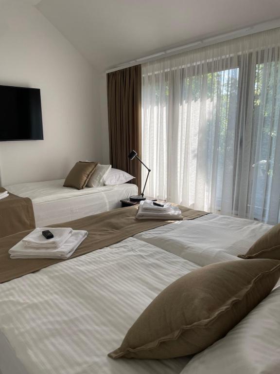 Posteľ alebo postele v izbe v ubytovaní Morpheus apartmani