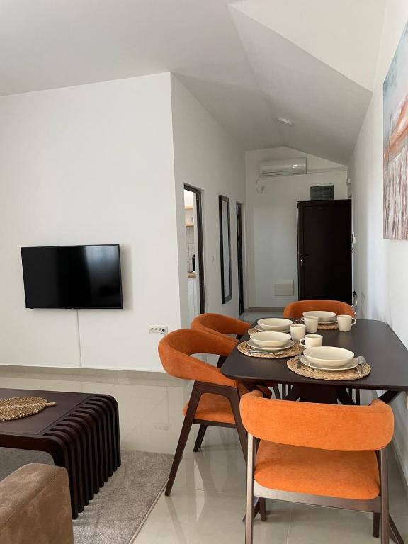 Televízia a/alebo spoločenská miestnosť v ubytovaní Morpheus apartmani
