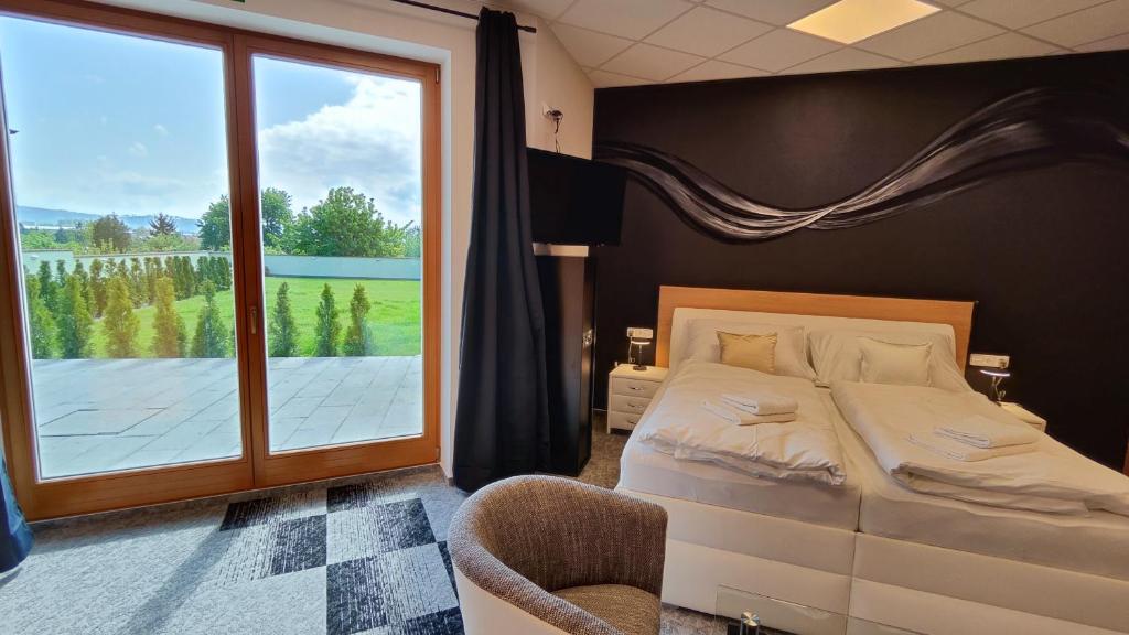 Postel nebo postele na pokoji v ubytování Apartmány Dačice