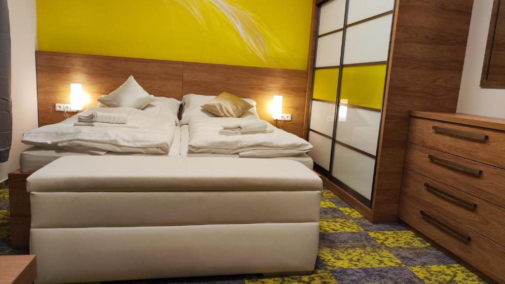 Postel nebo postele na pokoji v ubytování Apartmány Dačice