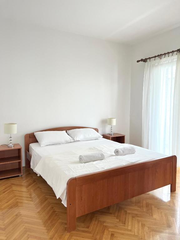 Postel nebo postele na pokoji v ubytování Apartments Keko