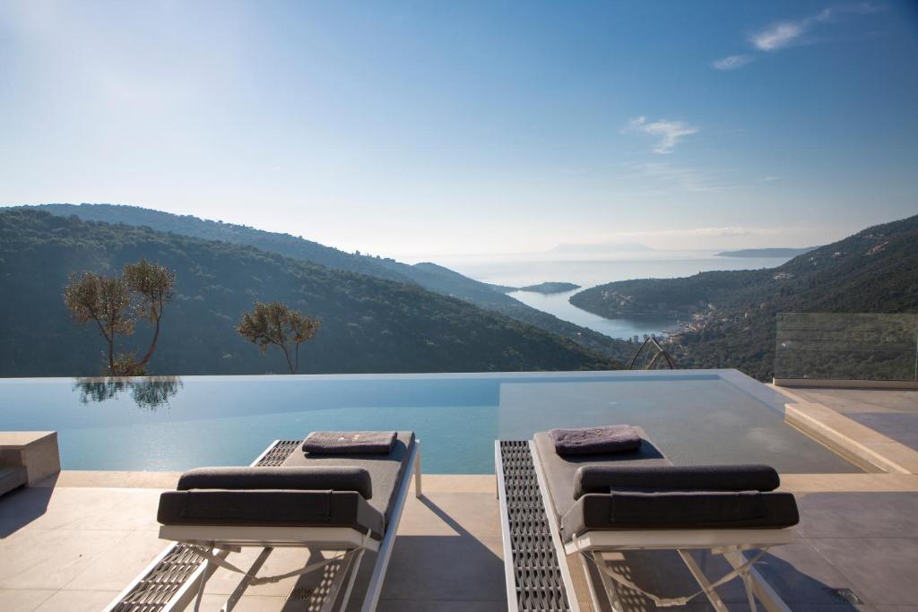 a swimming pool with a view of a mountain at Villa Rona Lefkada in Sivota