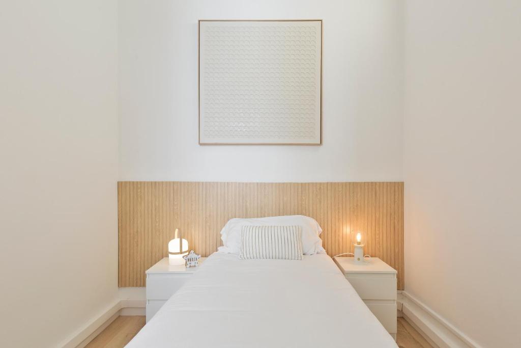 Posteľ alebo postele v izbe v ubytovaní Suites4days Gaudi Eixample