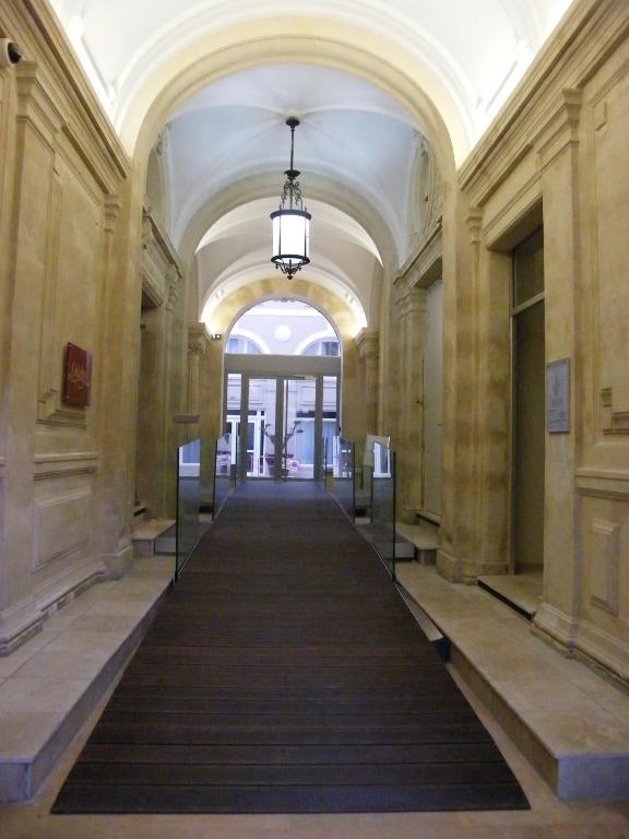 an empty hallway in a building with a long corridor at Odalys City Montpellier Les Occitanes in Montpellier