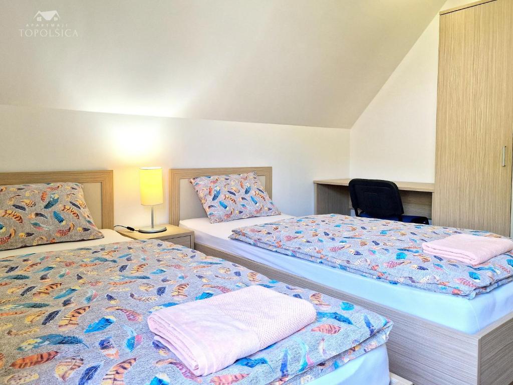 Postel nebo postele na pokoji v ubytování Apartment HORTENZIJA near Terme Topolšica