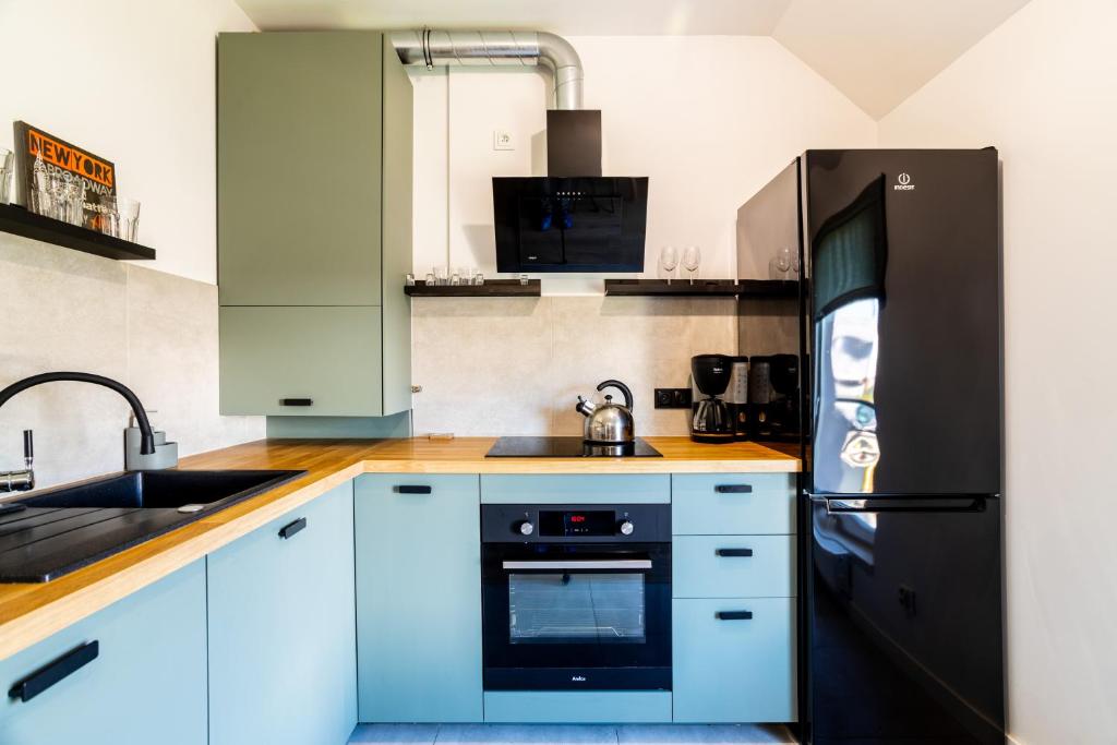 Kuchyňa alebo kuchynka v ubytovaní Apartamenty Cisza & Spoko! - ACCO RENT