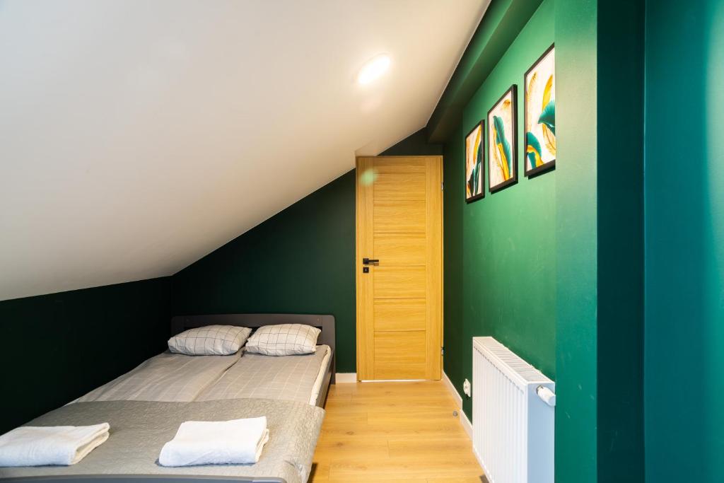 Posteľ alebo postele v izbe v ubytovaní Apartamenty Cisza & Spoko! - ACCO RENT