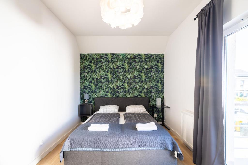 Posteľ alebo postele v izbe v ubytovaní Apartamenty Cisza & Spoko! - ACCO RENT