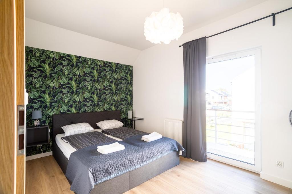 Posteľ alebo postele v izbe v ubytovaní Apartamenty Cisza & Spoko! - ACCO RENT
