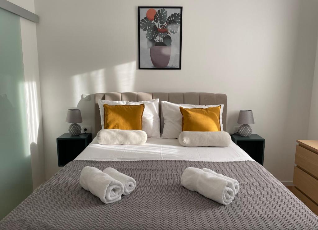 a bedroom with a bed with towels on it at Mediterra 1 in Crikvenica