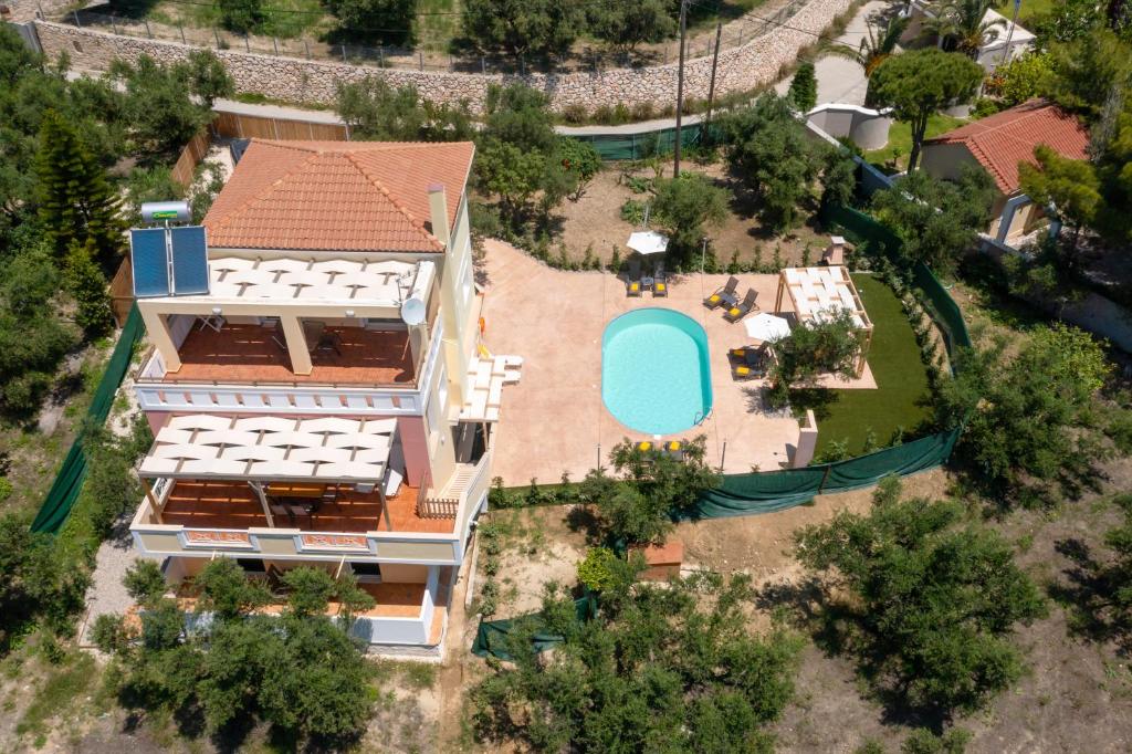 an aerial view of a house with a swimming pool at Villa Melody Complex in Akrotiri