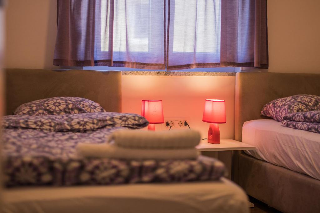 Postel nebo postele na pokoji v ubytování Apartmani Mario