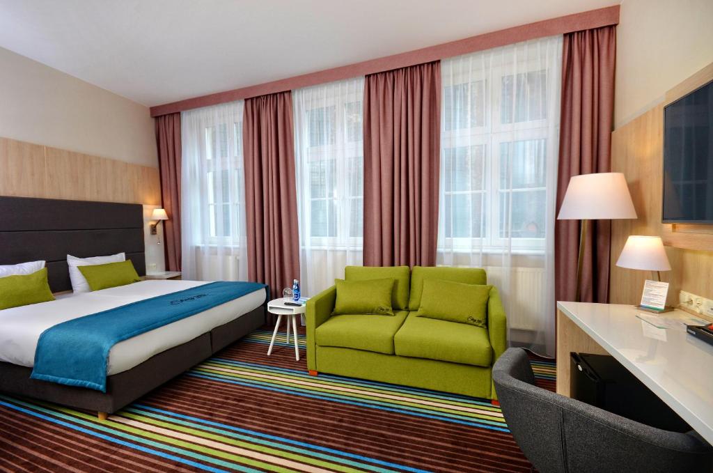Postel nebo postele na pokoji v ubytování Stay inn Hotel Gdańsk