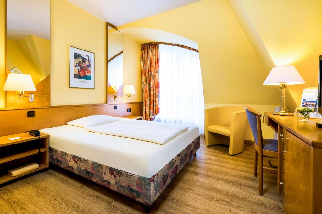 Postel nebo postele na pokoji v ubytování Taste Hotel Dresden-ehemals Residenz Alt Dresden