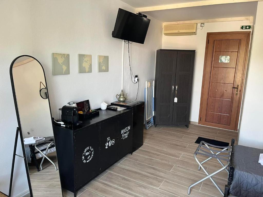 TV a/nebo společenská místnost v ubytování Vassilis Retreat
