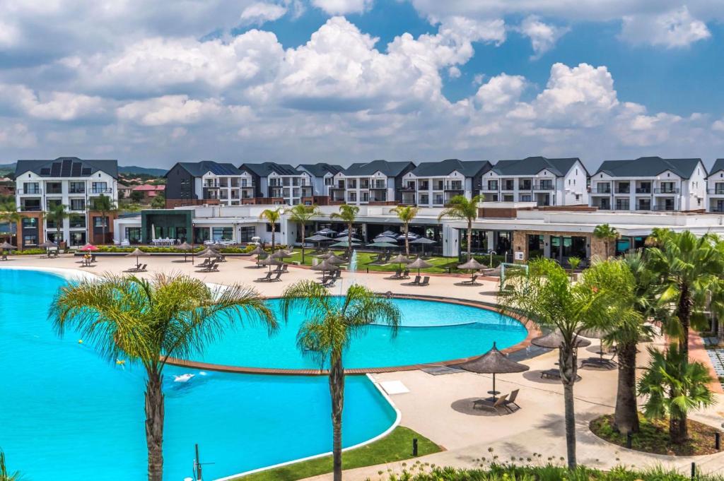 a view of the pool at the resort at 1254 The Blyde Crystal Clear 3 Bedroom Garden Apartment in Pretoria