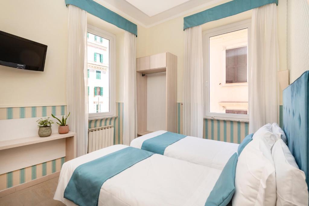 Postel nebo postele na pokoji v ubytování Hotel Parker - Gruppo BLAM HOTELS