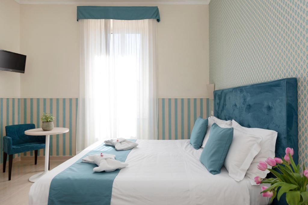 Postel nebo postele na pokoji v ubytování Hotel Parker - Gruppo BLAM HOTELS