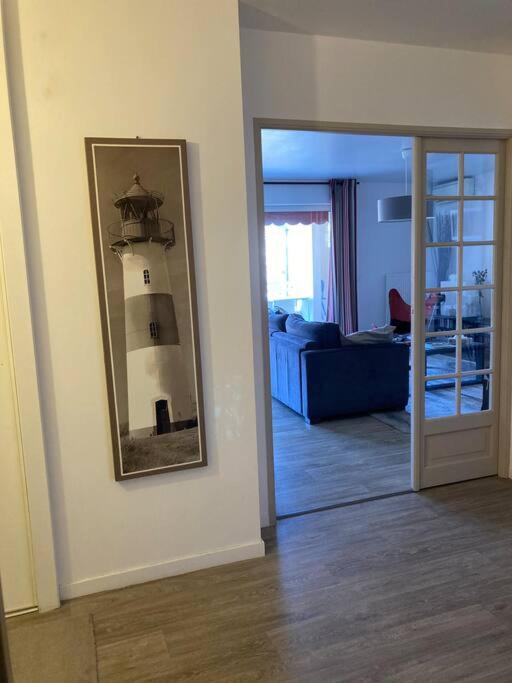 a room with a mirror and a room with a light house at Appart Hypercentre Biarritz - PKG &#47; WIFI &#47; 4-6 Personnes in Biarritz