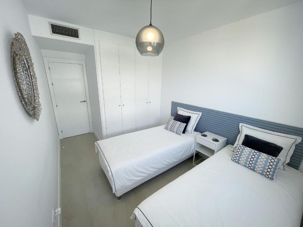 Posteľ alebo postele v izbe v ubytovaní Pure South Residence