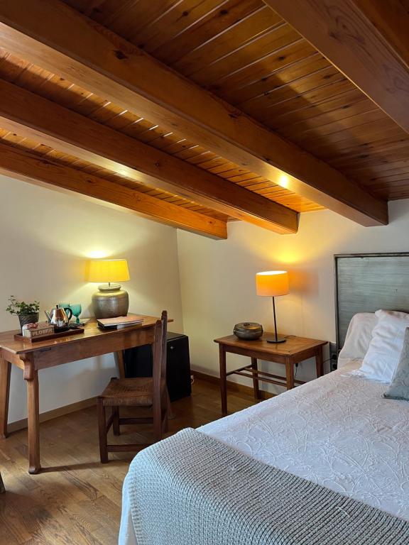 Postel nebo postele na pokoji v ubytování Hostal de la Plaça - Hotel Boutique