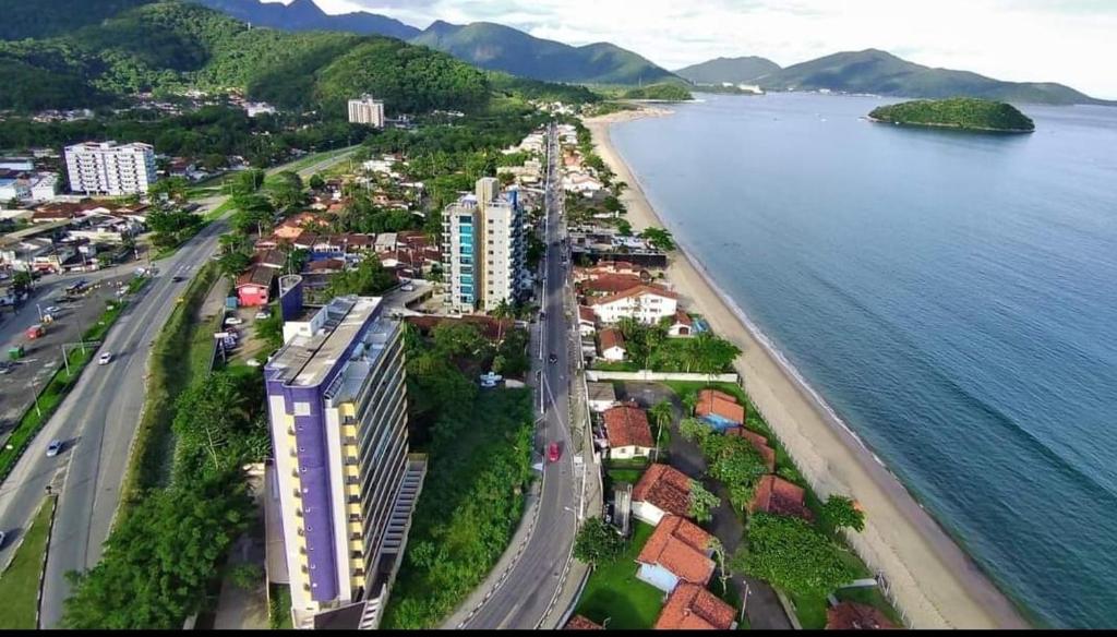 an aerial view of a city next to the water at Praia litoral norte SP 70 m praia in Caraguatatuba
