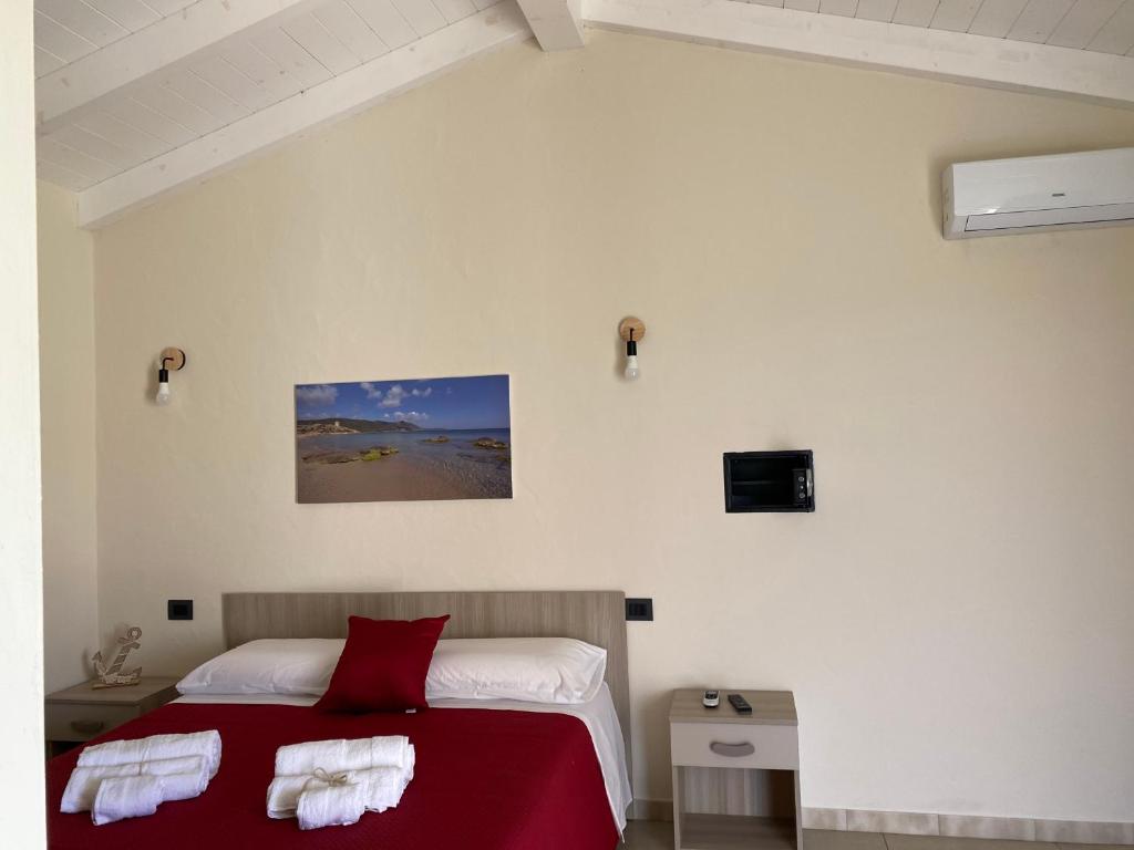 Voodi või voodid majutusasutuse Is Arenas Biancas Agriturismo toas