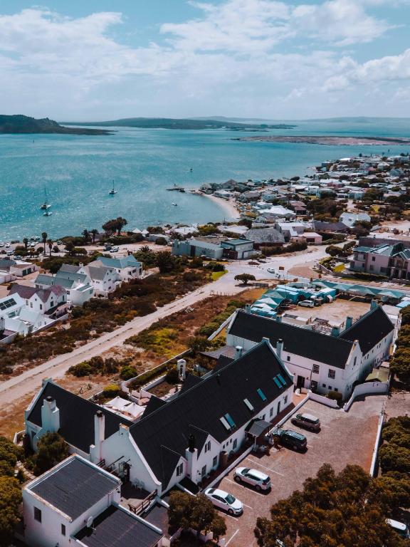 una vista aérea de un pueblo junto al agua en The Farmhouse Hotel, en Langebaan