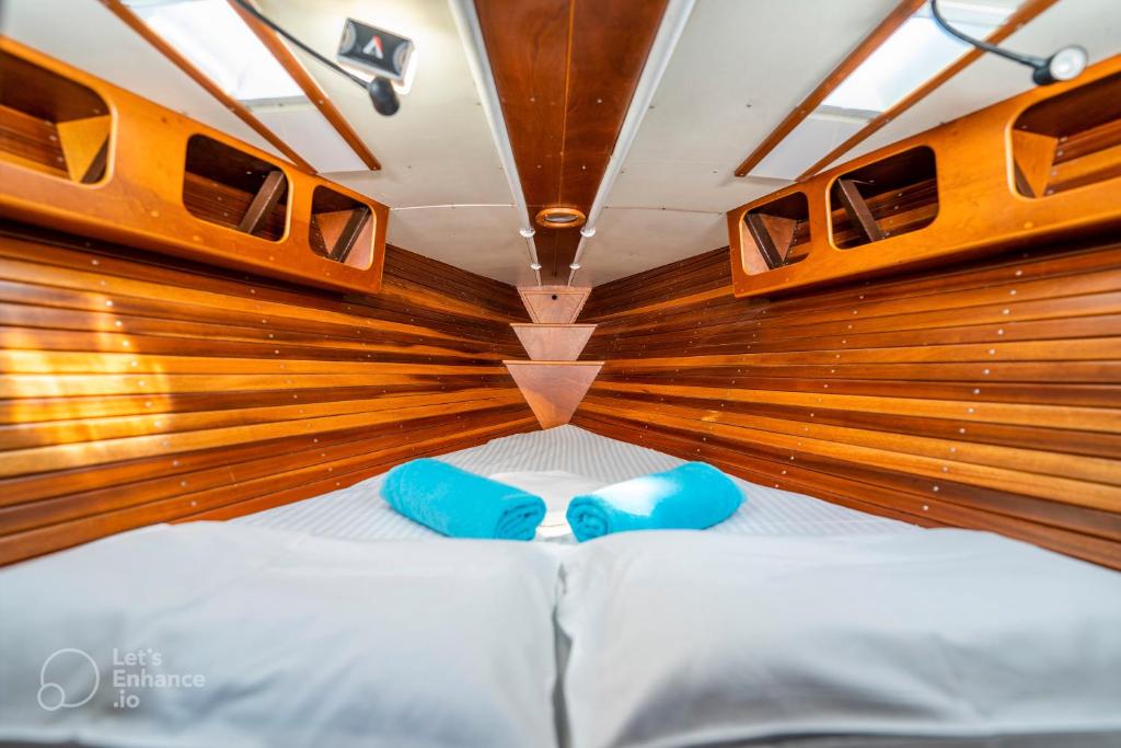 a large bed in the back of a boat at Cyclades sailing Experience in Finikas