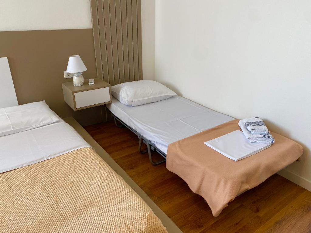 Postel nebo postele na pokoji v ubytování New Central Apartment