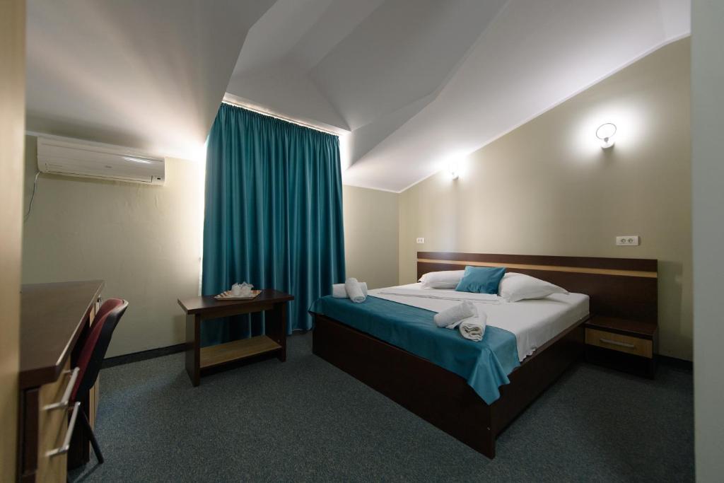 Postel nebo postele na pokoji v ubytování Hotel Cora