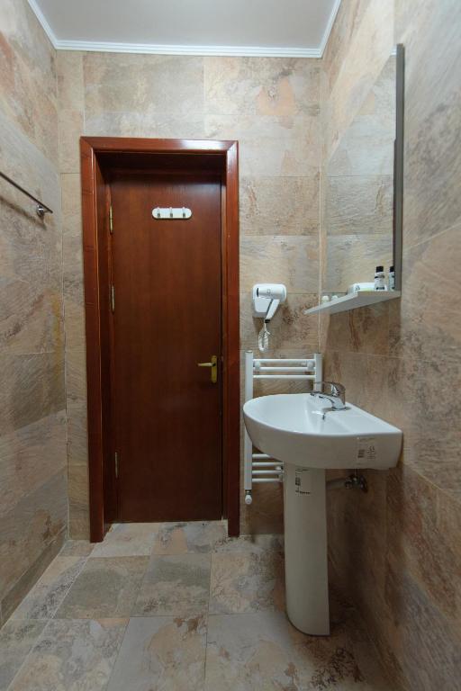 Koupelna v ubytování Hotel Cora