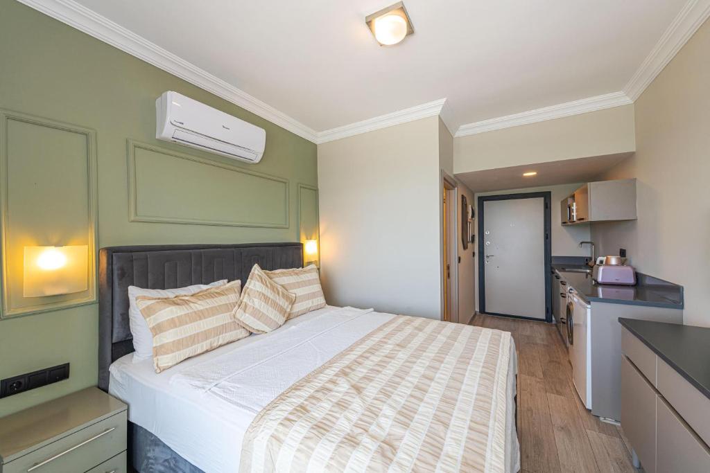 Postel nebo postele na pokoji v ubytování IDEE SUİTES Fethiye
