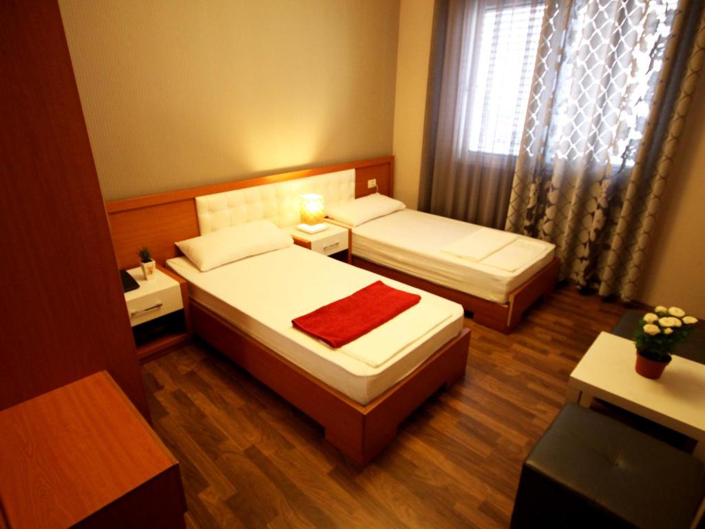 Postel nebo postele na pokoji v ubytování Hotel Bylis