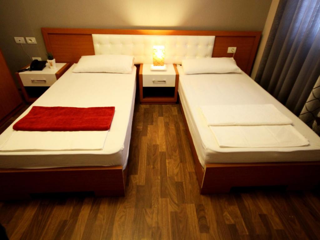 Postel nebo postele na pokoji v ubytování Hotel Bylis