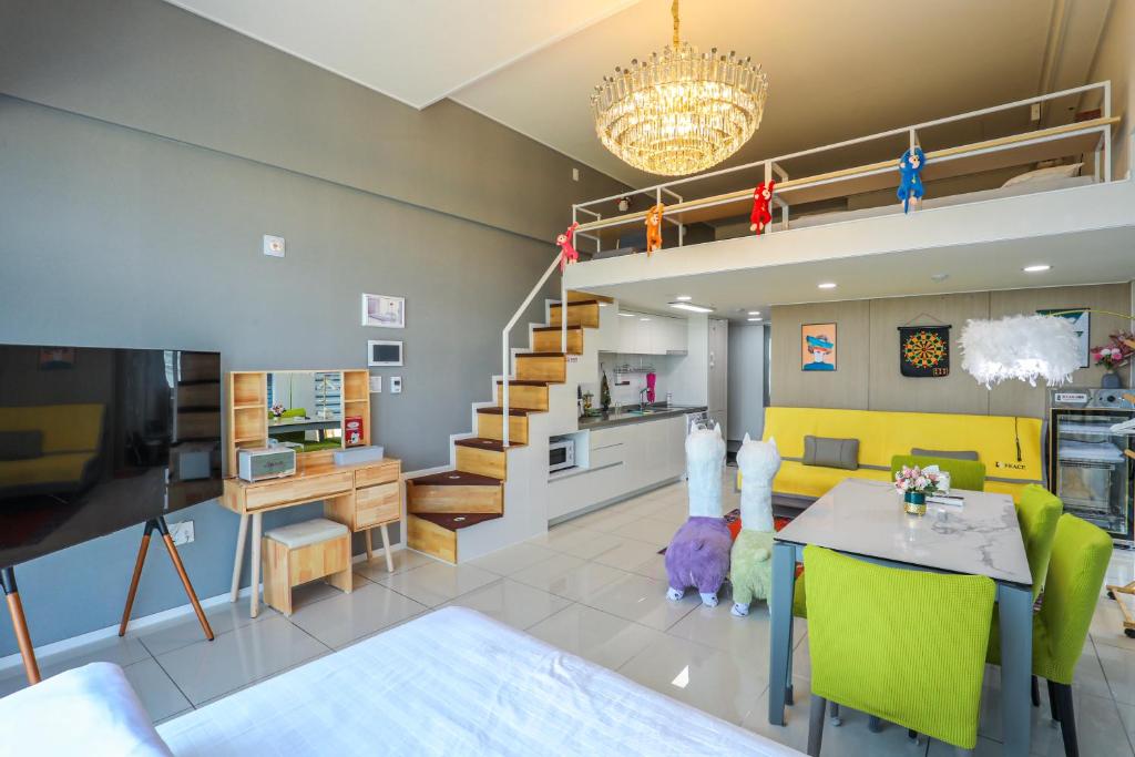 a living room with a yellow couch and a table at Romang House in Incheon