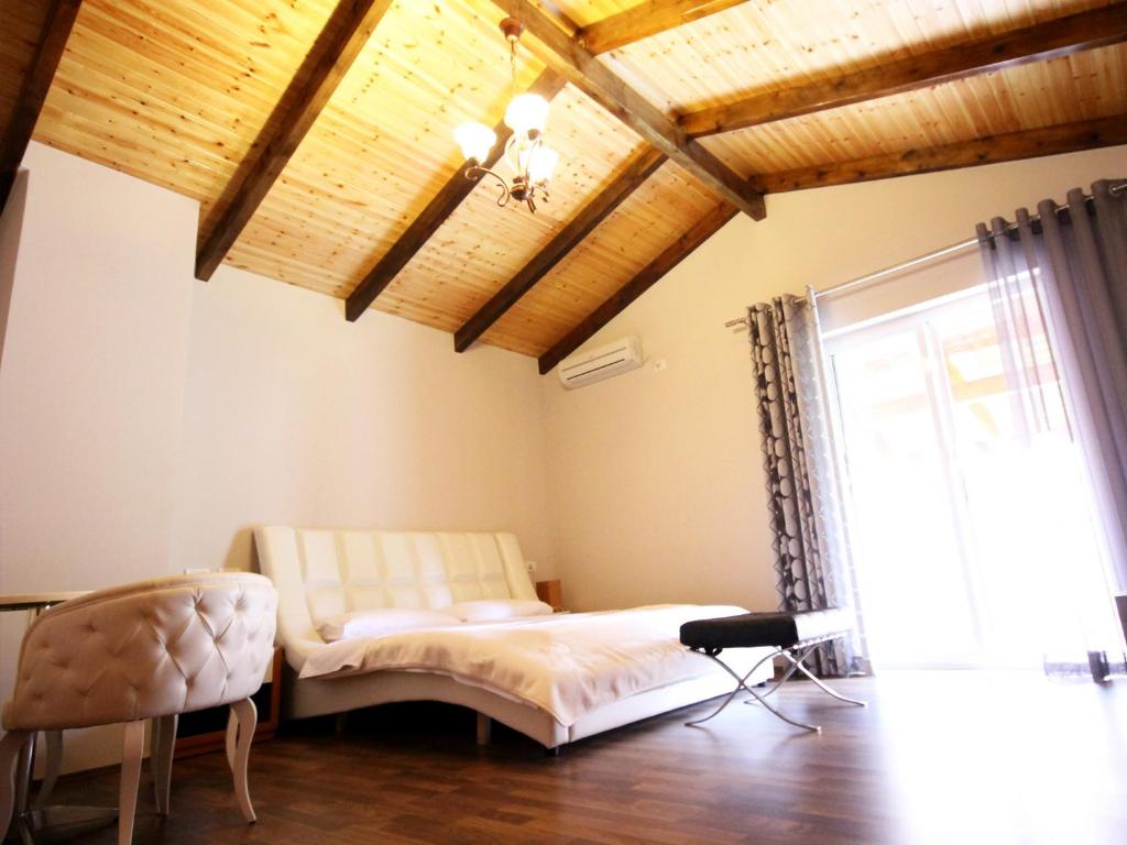 Postel nebo postele na pokoji v ubytování Hotel Bylis